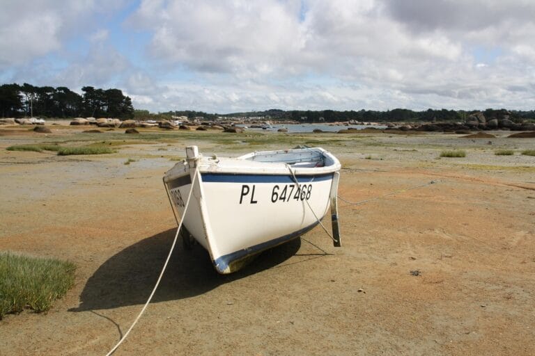 A traditional Breton boat at low tide in Sainte-Anne bay, Trégastel
