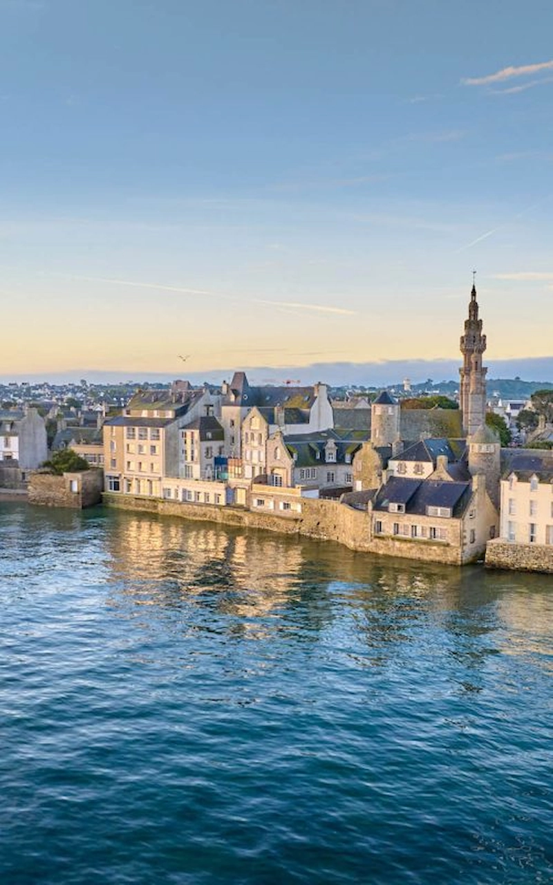 Roscoff old town and the bell tower of Notre-Dame de Croaz-Batz reflected in the sea
